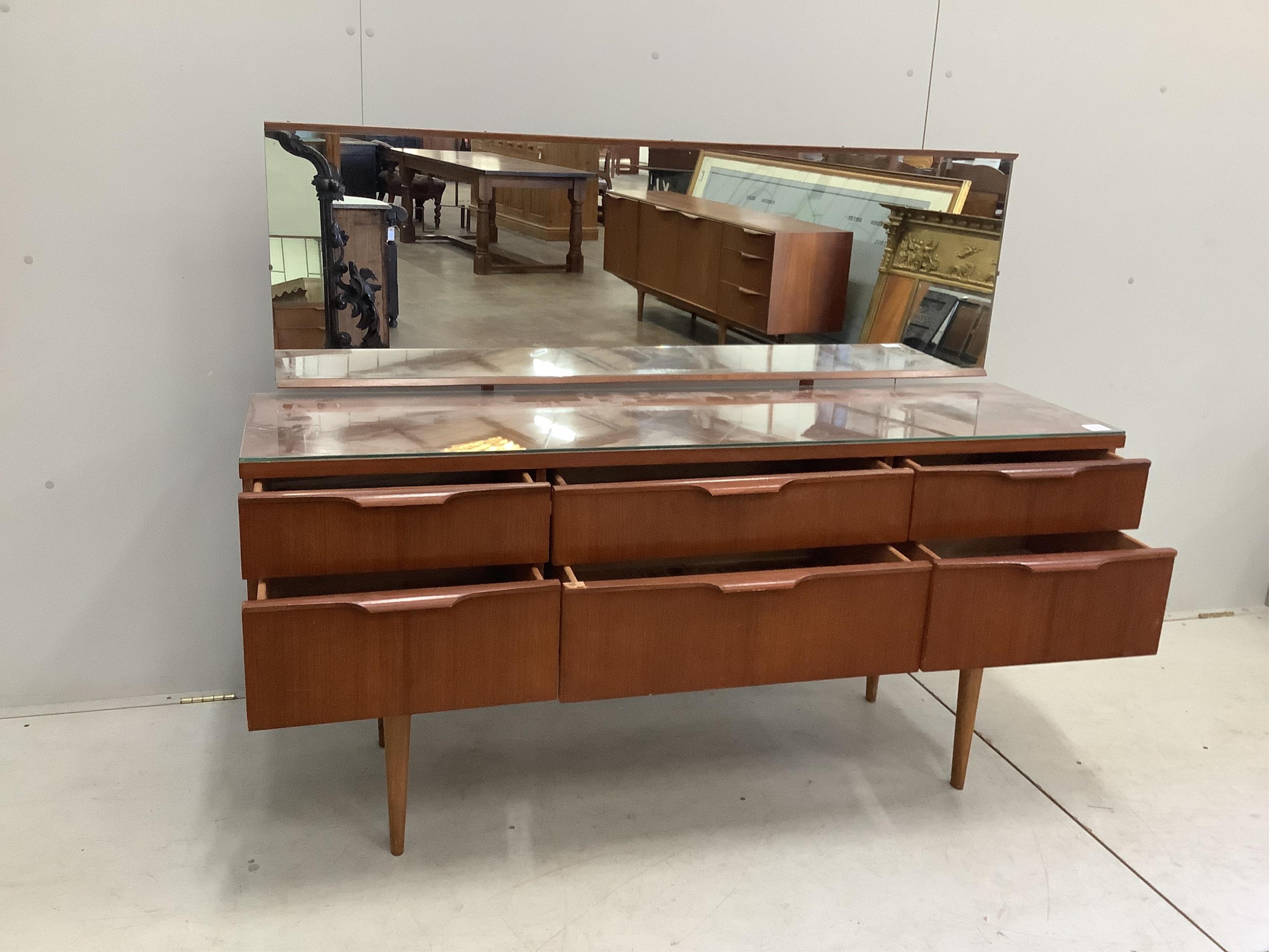 A mid century G plan six drawer dressing table, width 151cm, depth 42cm, height 117cm. Condition - fair to good